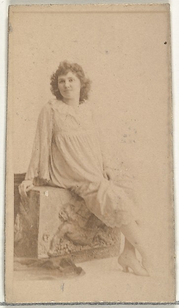 [Seated actress dressed in loose white gown], from the Actors and Actresses series (N145-8) issued by Duke Sons & Co. to promote Duke Cigarettes