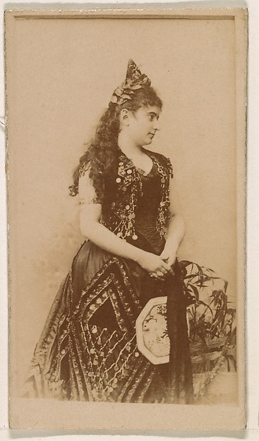 Actress in long dark gown, from the Actresses series (N245) issued by Kinney Brothers to promote Sweet Caporal Cigarettes
