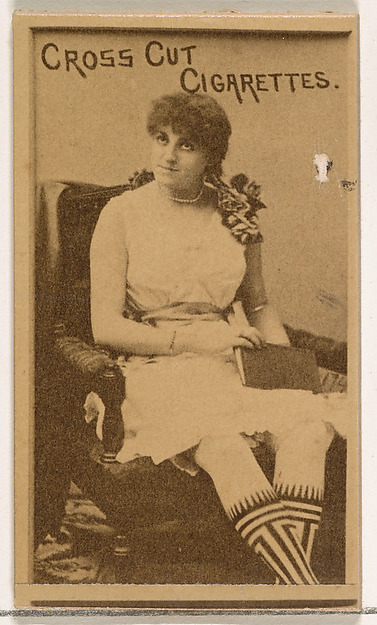 Seated actress wearing patterned stockings, from the Actors and Actresses series (N145-1) issued by Duke Sons & Co. to promote Cross Cut Cigarettes