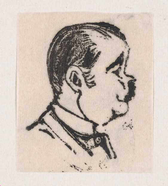 A profile of a man with a dark mustache looking to the right
