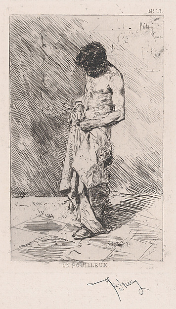 Young man standing dressed in rags
