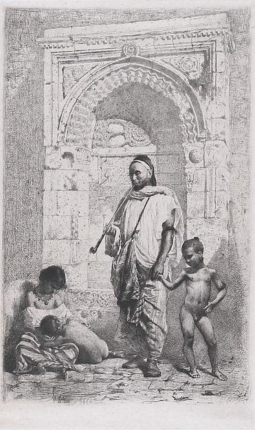 A Moroccan family in front of an arch, father standing, mother lower left on the ground holding a child