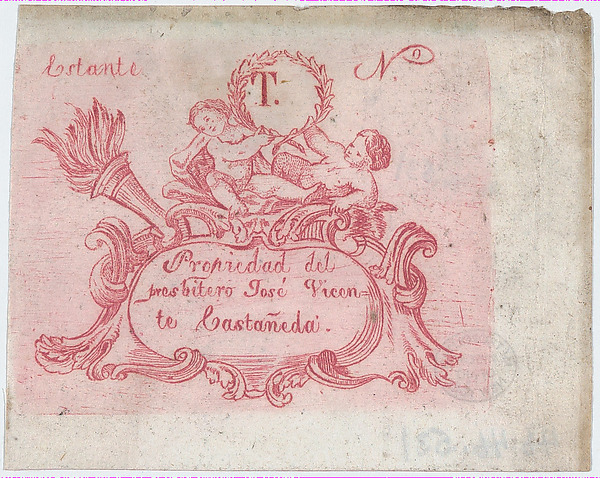Ornament plaque with angels on top holding a wreath