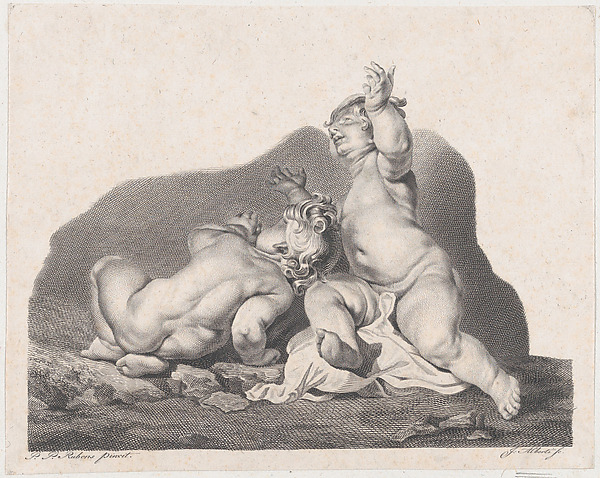 Two children lying on the ground, one seen from behind