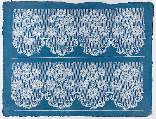 Blue sheet with two borders with a white floral and lace pattern