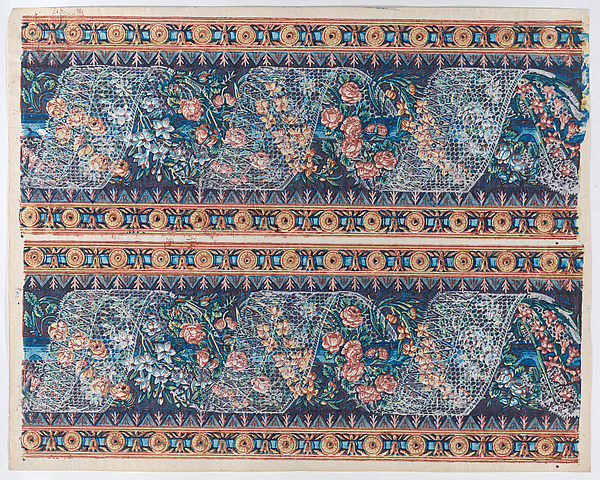 Sheet with two borders with lace atop a floral garland against a navy background
