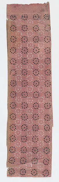 Fragment of a sheet with a pattern of dots in circles