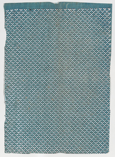 Sheet with overall pattern of dots in triangular shapes