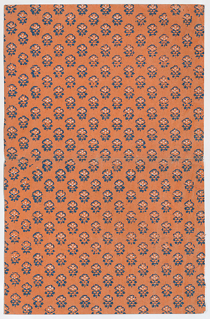 Orange book cover with overall floral pattern