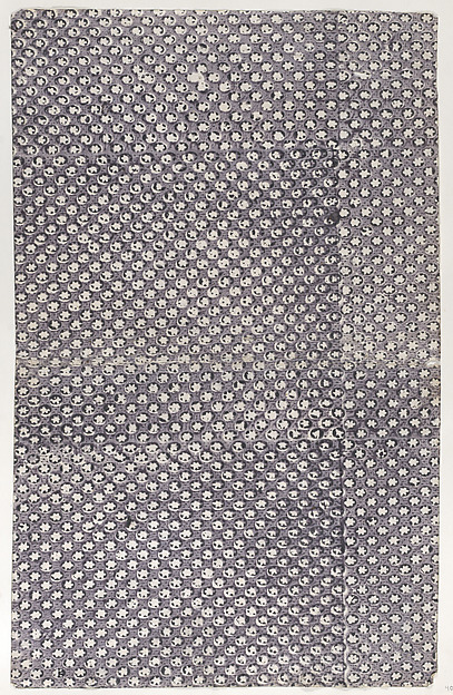 Sheet with overall pattern of triangles and dots