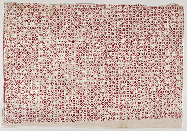 Sheet with a red geometric and floral pattern