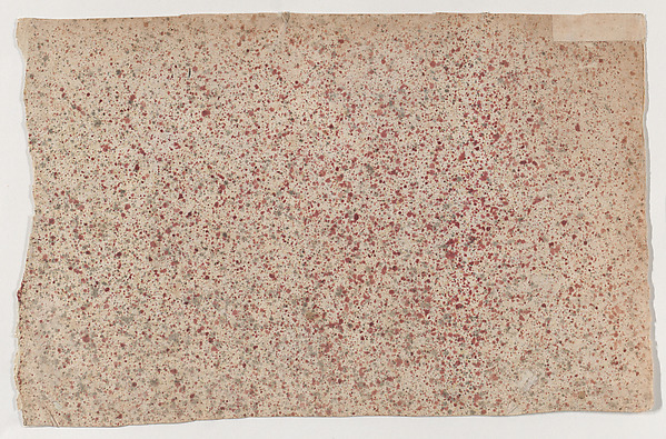 Sheet with an overall red speckle pattern