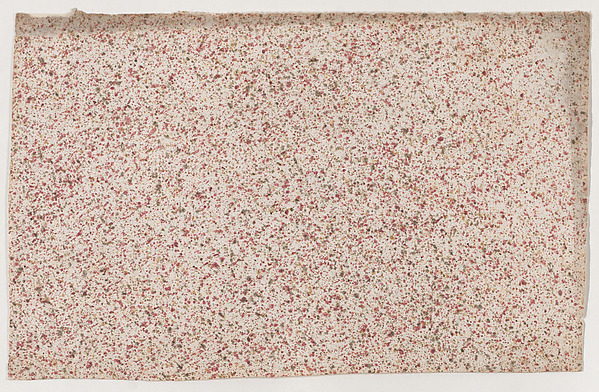 Sheet with an overall red speckle pattern