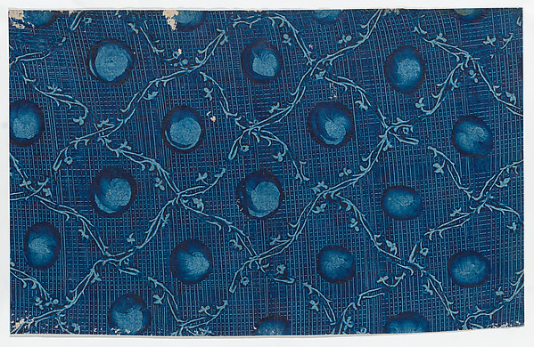 Blue paste paper with circular designs and ornamental diagonal pattern and crisscross background