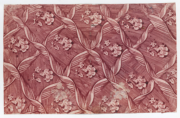 Paste paper with overall red floral and ribbon pattern