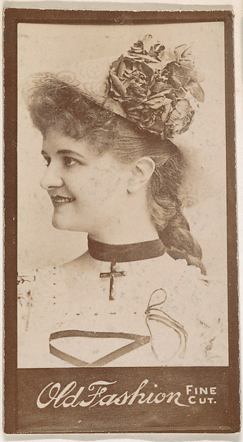 Actress wearing necklace with cross, from the Actresses series (N664) promoting Old Fashion Fine Cut Tobacco