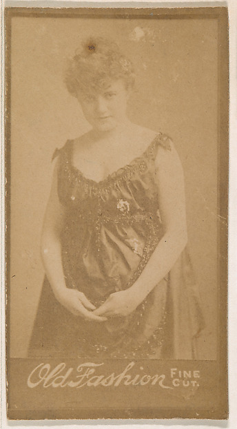 Standing actress, from the Actresses series (N664) promoting Old Fashion Fine Cut Tobacco