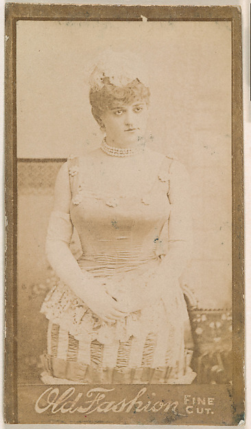 Actress standing with hands clasped at waist, from the Actresses series (N664) promoting Old Fashion Fine Cut Tobacco
