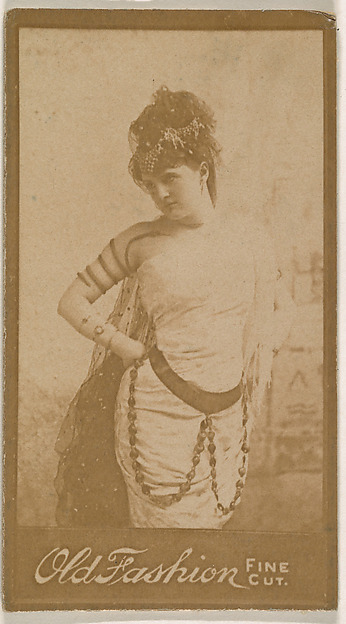 Actress wearing costume with spiral armband, from the Actresses series (N664) promoting Old Fashion Fine Cut Tobacco