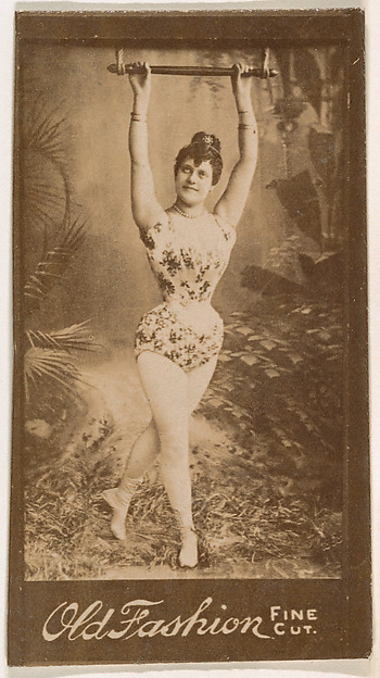 Actress holding onto metal bar above head, from the Actresses series (N664) promoting Old Fashion Fine Cut Tobacco