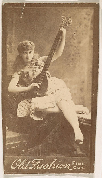 Actress playing mandolin, from the Actresses series (N664) promoting Old Fashion Fine Cut Tobacco