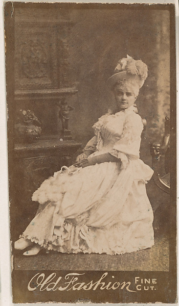 Actress wearing feathered hat, from the Actresses series (N664) promoting Old Fashion Fine Cut Tobacco