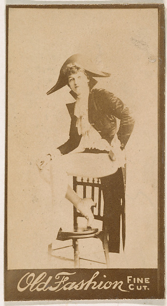 Seated actress wearing military-inspired costume, from the Actresses series (N664) promoting Old Fashion Fine Cut Tobacco