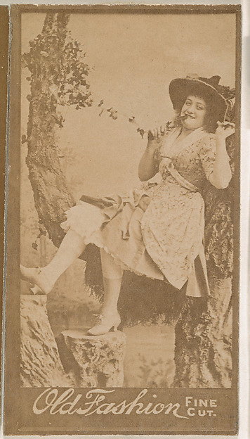 Actress holding ivy vine, from the Actresses series (N664) promoting Old Fashion Fine Cut Tobacco