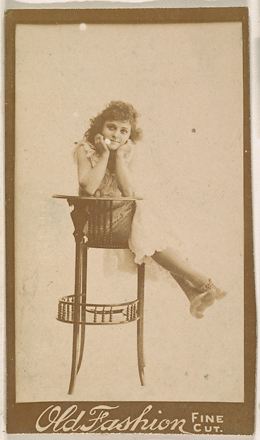 Actress posing on back of tall chair, from the Actresses series (N664) promoting Old Fashion Fine Cut Tobacco
