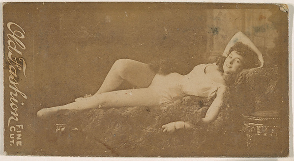 Actress reclining on sofa, from the Actresses series (N664) promoting Old Fashion Fine Cut Tobacco