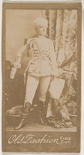 Actress holding paper at side, from the Actresses series (N664) promoting Old Fashion Fine Cut Tobacco