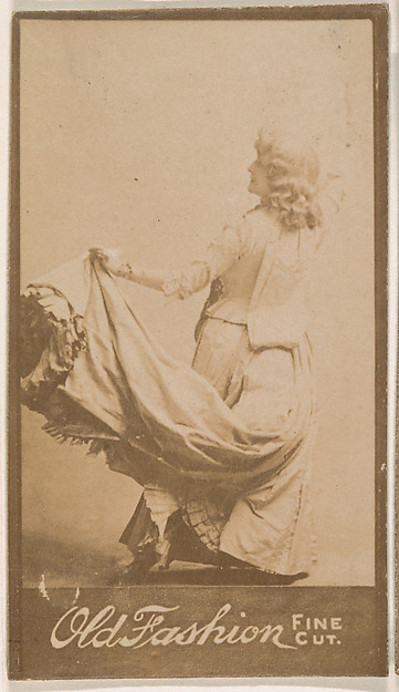 Actress holding up part of costume, from the Actresses series (N664) promoting Old Fashion Fine Cut Tobacco