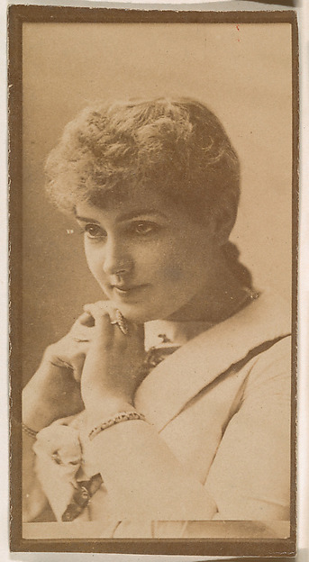 Actress resting chin on hands from the Actresses series (N664) promoting Old Fashion Fine Cut Tobacco