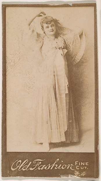 Actress leaning against wall, from the Actresses series (N664) promoting Old Fashion Fine Cut Tobacco