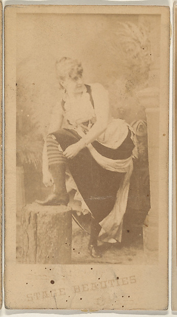 Actress wearing costume with striped tights, from the Actresses series (N666) to promote Stage Beauties Cigars