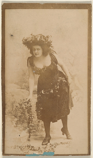 Actress wearing costume with floral headpiece, from the Actresses series (N668)