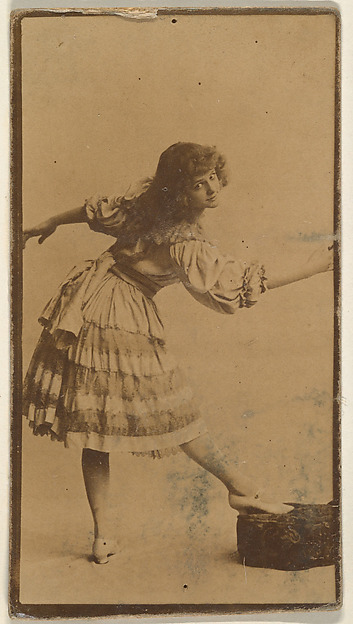 Actress posing with foot on cushion, from the Actresses series (N668)