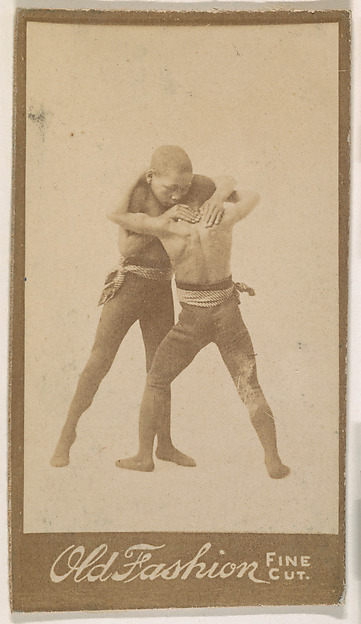 Two boys wrestling, from the "Negro Subjects" series (N692) promoting Old Fashion Fine Cut Tobacco