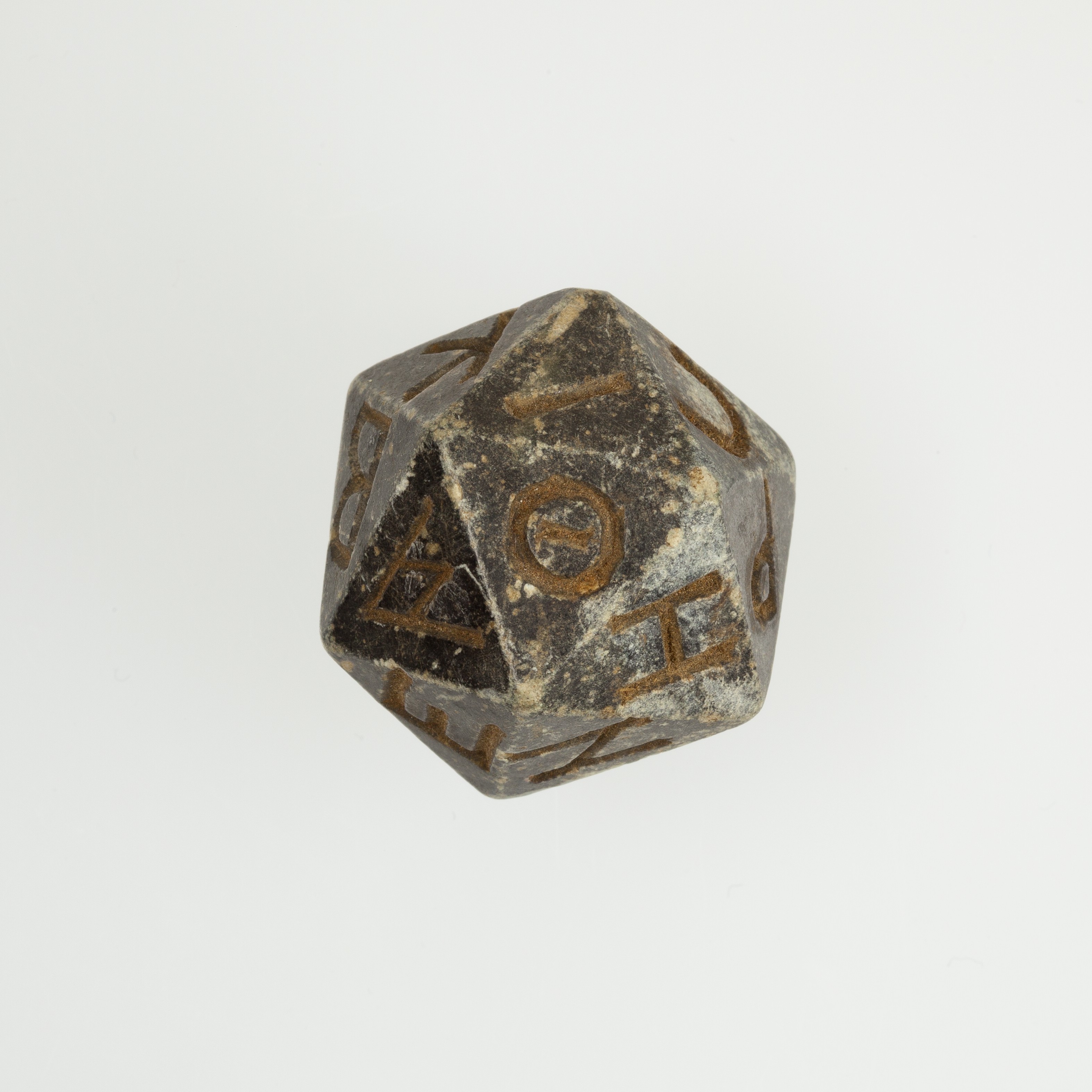 Twenty-sided die (icosahedron) with faces inscribed with Greek