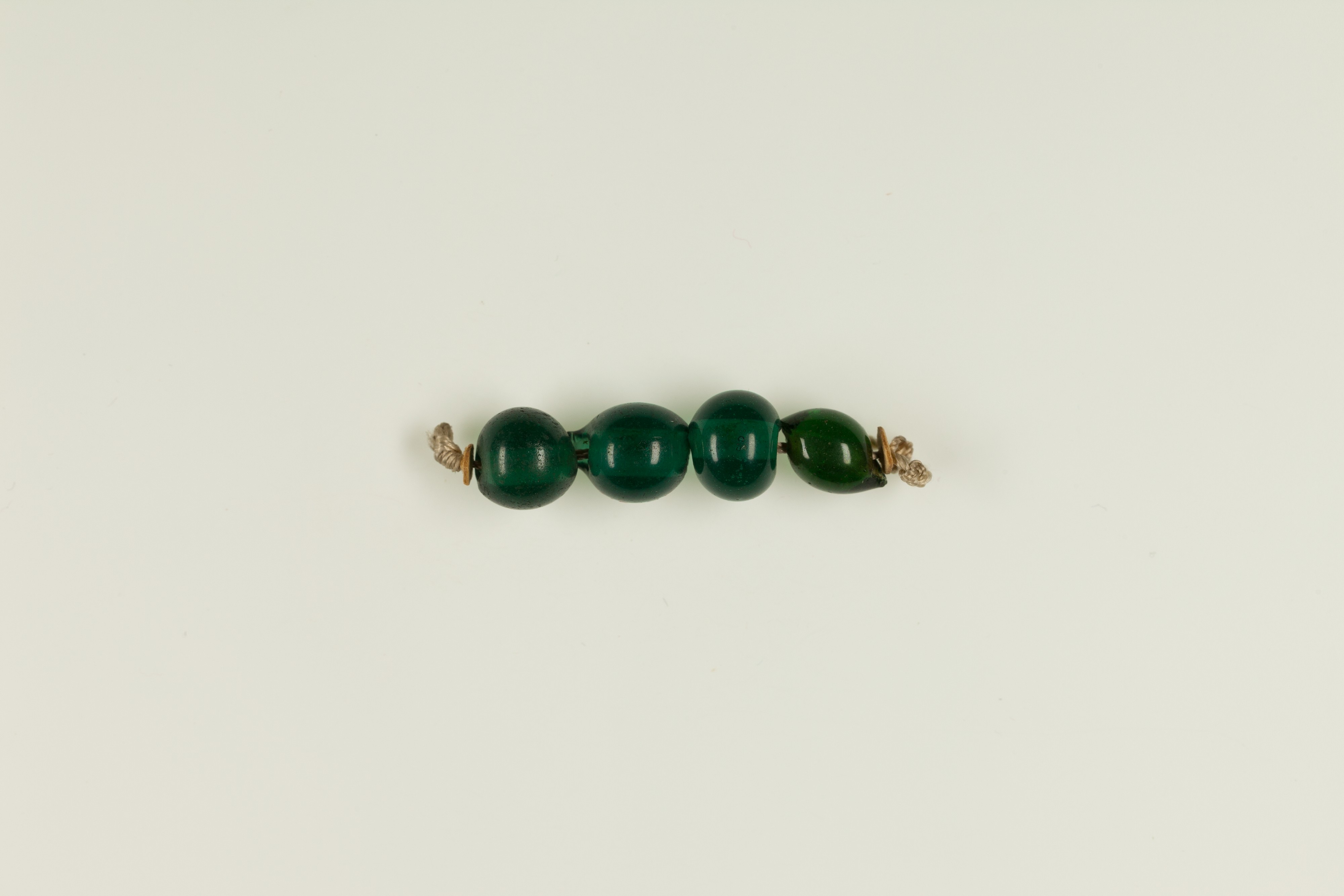 String of 4 spheroid beads