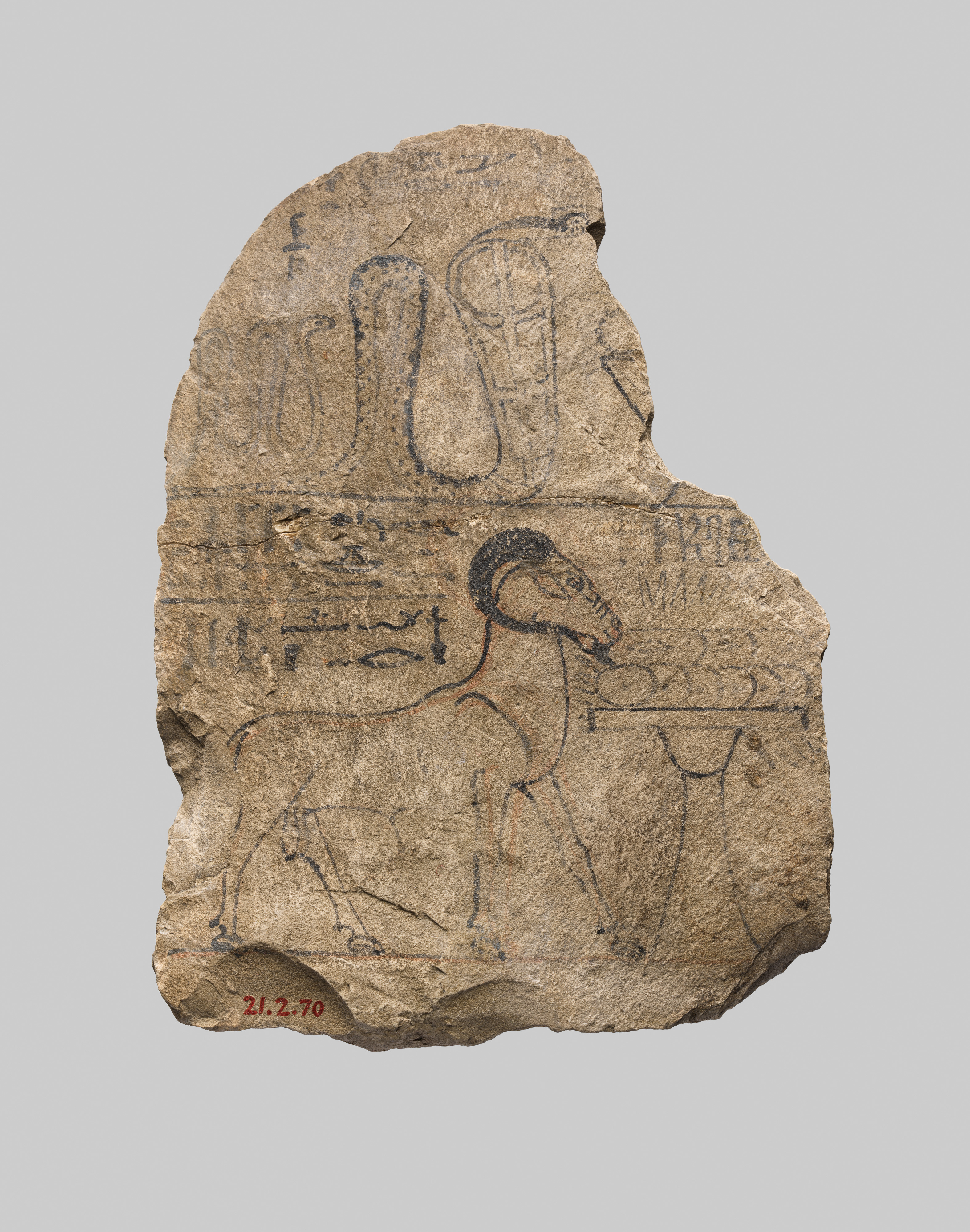 Round-topped ostracon depicting the snake-goddess Mereseger and Amun's ram, signed by Neferhotep