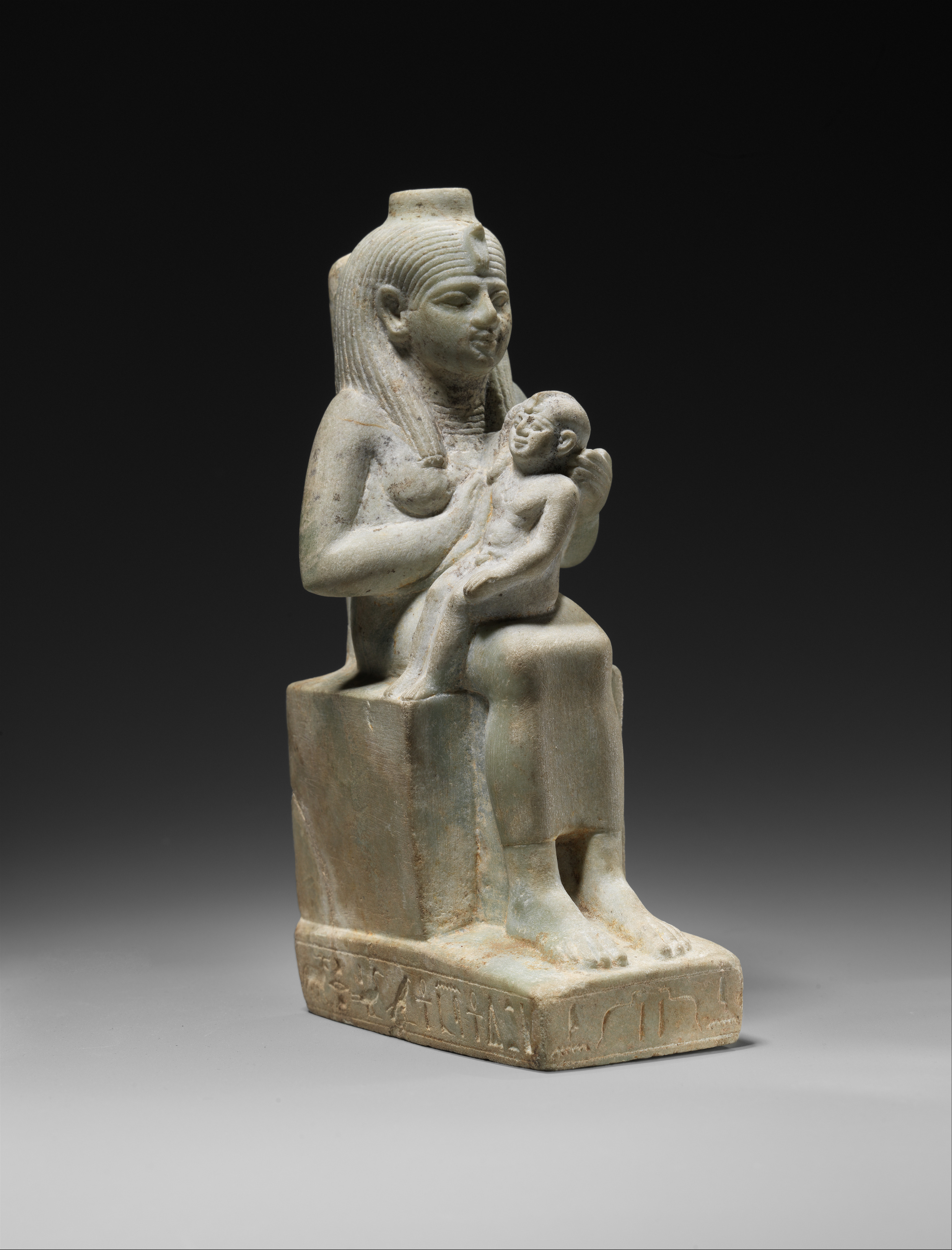 Ancient Egyptian statue of goddess Isis breastfeeds her son Horus made ...