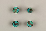 Seven Spool-Shaped Gaming Pieces, Faience