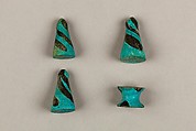 Seven Spool-Shaped Gaming Pieces, Faience