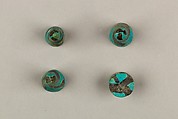 Seven Spool-Shaped Gaming Pieces, Faience