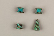 Seven Spool-Shaped Gaming Pieces, Faience