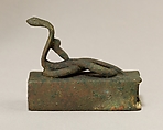 Box for an animal mummy surmounted by a coiled, rearing snake, Cupreous metal