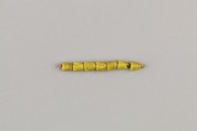 String of 7 beads, Yellow glass