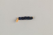 String of 5 four-sided beads, Translucent dark blue glass