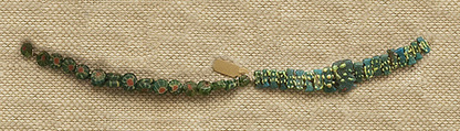 String of 19 "Bes" Beads, Faience